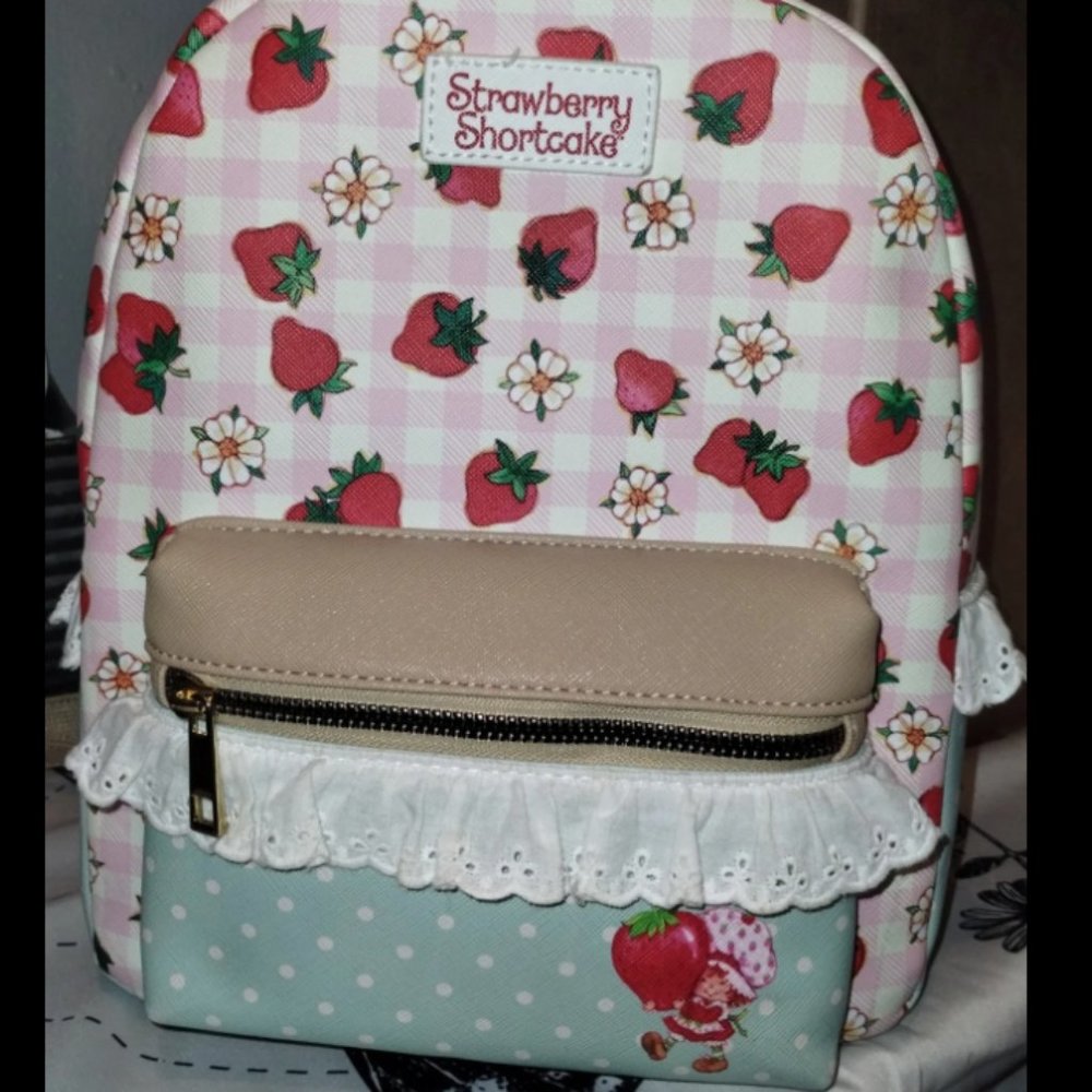 Previously loved Strawberry Shortcake mini 11” backpack from Bioworld Hot Topic